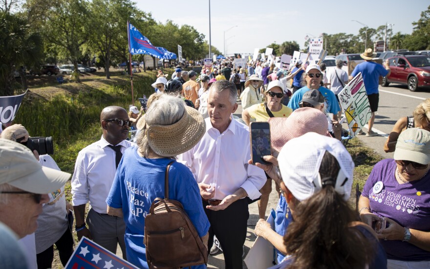 Florida gubernatorial candidate David Jolly greets people at the No Kings rally on Saturday, March 28, 2026, in Fort Myers.