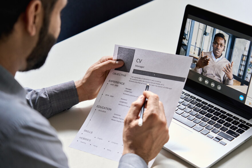 Male hr, recruiter or employer holding cv having online virtual job interview meeting with candidate on video call.