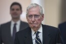 a man in a suit seemingly frowning