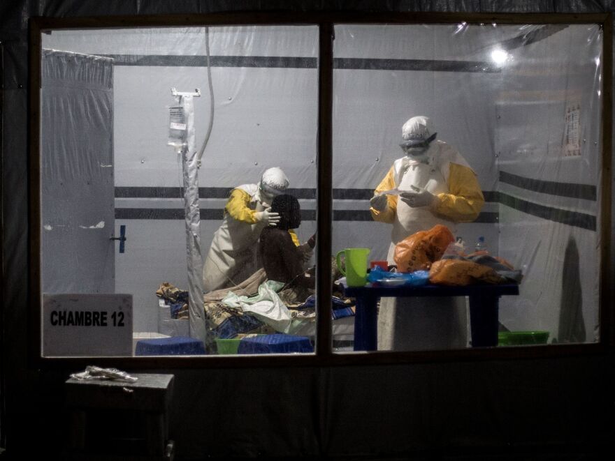 Health workers treat a patient who is suspected of having contracted Ebola earlier this month in Butembo, Democratic Republic of the Congo.