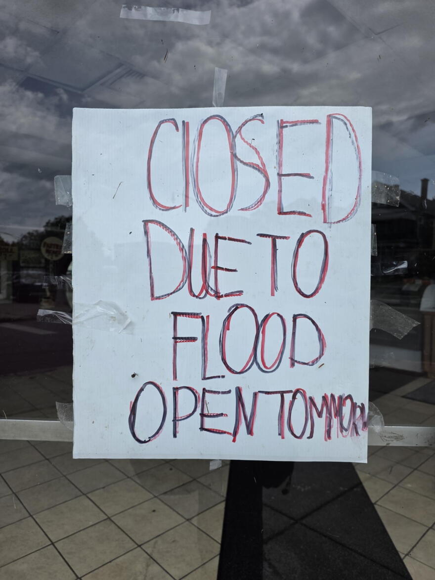A sign posted on the door of Gino's Italian Bakery on Sept. 4 following flooding on Hertel Avenue