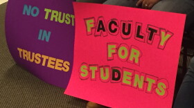 Wright State faculty union members protest at a 2018 Board of Trustees meeting. 