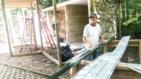 On June 23, Jesse Fluty with Tomahawk Services gathers J-channel for the new temporary raptor enclosures beside the Wesselman Woods Nature Center. This enclosure will house raptors as the new mews are being built, and provide an alternate shelter when needed.