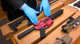 In this file photo taken Wednesday, Nov. 27, 2019, is Sgt. Matthew Elseth with “ghost guns” on display at the headquarters of the San Francisco Police Department in San Francisco.