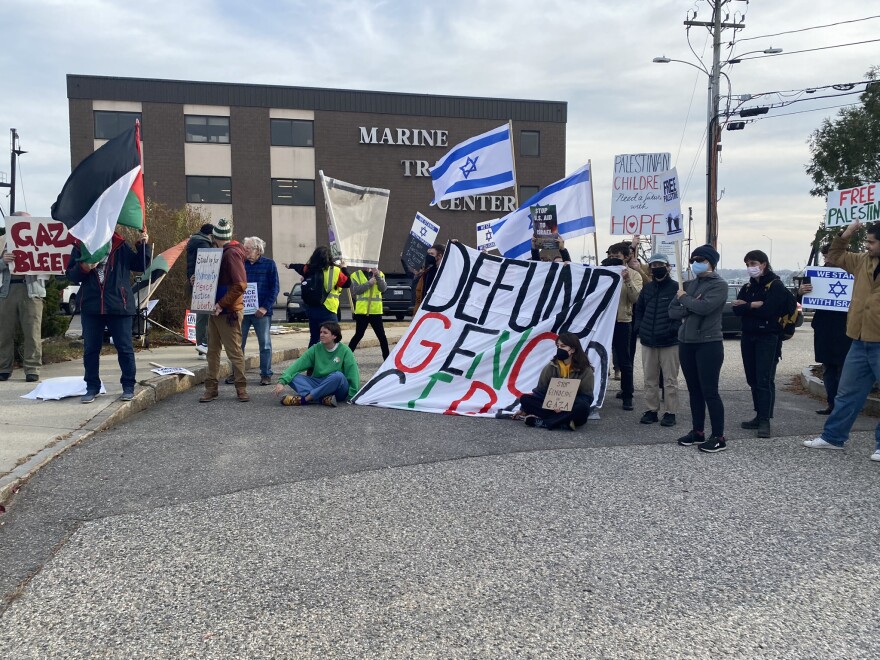 Protesters and counter-protesters at a ceasefire rally near Rep. Pingree's office in Portland on Friday.