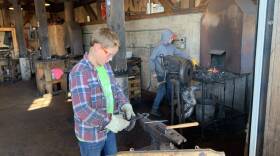Young students in the blacksmith shop at the North House Folk School in Grand Marais, MN. (Jon Kalish)