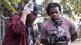Photojournalist and filmmaker Michael Cheers, left, checks the shot by cinematographer and editor Bryce Lawson while filming "Fort Scott Stories."