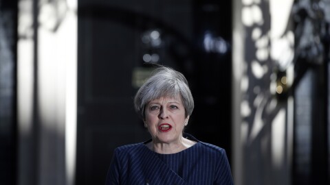 Britain's Prime Minister Theresa May speaks to the media outside her official residence of 10 Downing St. in London on Tuesday. May announced she will seek early elections to be held June 8.