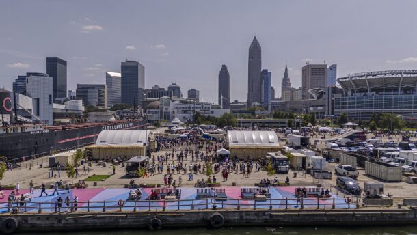 A photo documents Downtown Cleveland lakefront activities organized in 2025 by the nonprofit North Coast Waterfront Development Corp. to activate the area identified for future parks and development projects.