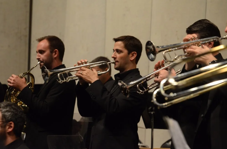 UMKC Conservatory Assistant Professor of Trumpet Matthew Vangjel (center) with other brass players.