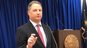 Indiana House Speaker Todd Huston speaks with reporters on Thursday, Feb. 4, 2021, at the Indiana Government Center in Indianapolis. Huston and other Republican leaders are supporting a proposal moving quickly through the Legislature to shield businesses and others from lawsuits by people blaming them for contracting COVID-19.