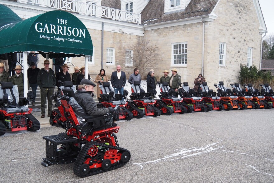 Jeremy Warriner, the founder of disability advocacy group Walking Spirit, takes the ceremonial first ride in a new all-terrain trackchair on Tuesday, March 17, 2026, in Indianapolis, Indiana.