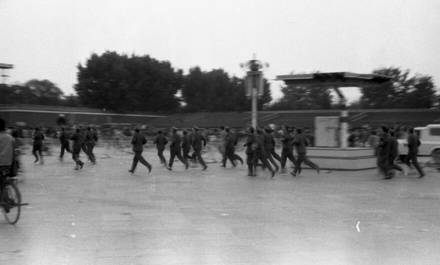 Police in motion near Tiananmen Square. There had been a massive police and military presence in the previous weeks, but no armed crackdown on the demonstrators until June 4.