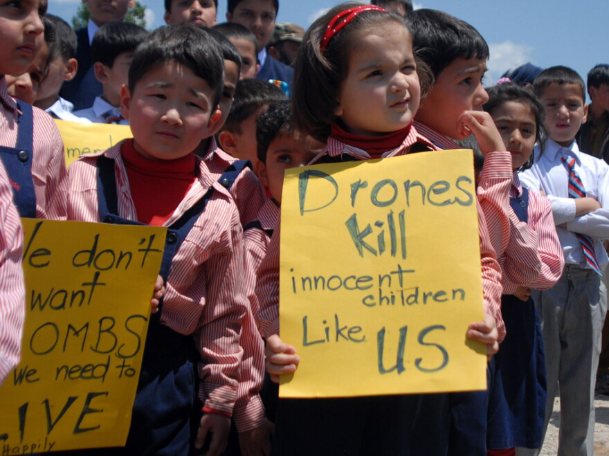 Pakistani school children carry placards during a protest at the site of the demolished compound of slain Al-Qaeda leader Osama bin Laden in northern Abbottabad on May 2, 2012 on the first anniversary of the death of Osama bin Laden.