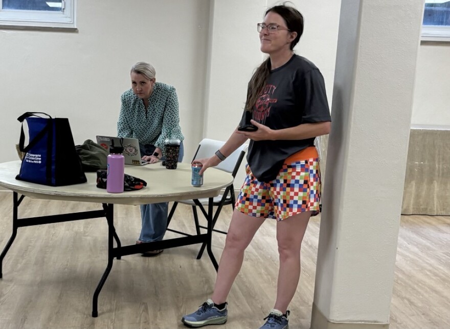 Executive director Alyssa Curry and assistant stage manager Sarah Newman observe as the cast sings.