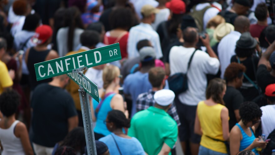 Hundreds of demonstrators gathered at the spot where Michael Brown was shot and killed. The crowd observed 4 1/2 minutes of silence, one minute for each of the 4 1/2 hours that Brown's body lay in the street before being taken away.