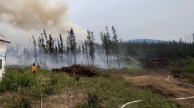 Clear Fire crews conduct a burnout operation earlier this month to protect a structure in the path of the fire. The controlled burn removes vegetation and other fuels to reduce the chances of a wildfire burning in the area.