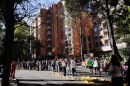 People stand outside their homes after a quake was felt in Bogota, Colombia, Monday, Aug. 10, 2026.
