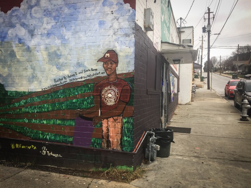 Kids in the Ashview Heights community painted a mural on the side of the Fair Street Superette, the corner store near the site for Marddy's shared kitchen and marketplace.