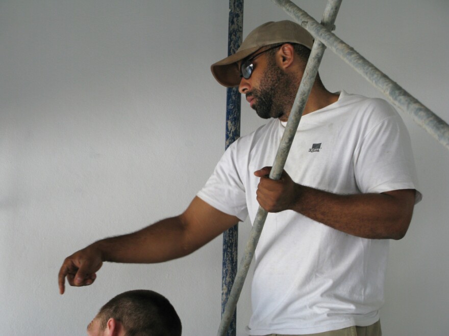 Dr. David Walton, a physician from Boston, oversees the final touches on the staircase of the main lobby of the National Teaching Hospital in Mirebalais, Haiti. "One of the lessons this hospital can provide is how to provide really outstanding infrastructure and construction practices at a fraction of what it may cost in other settings," he says.