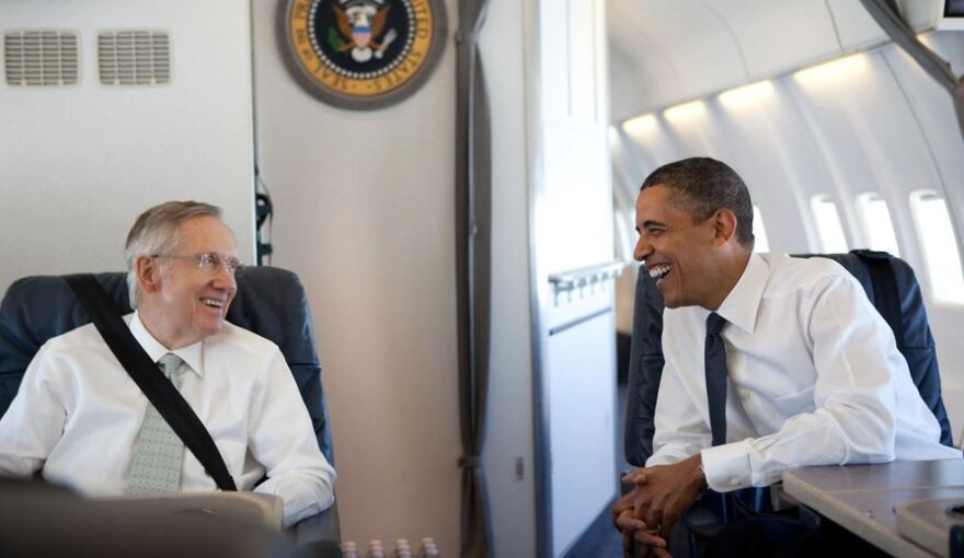 President Barack Obama talks with U.S.Senate Majority Leader Harry Reid