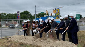 Representatives of First Merchants Banks and Indianapolis officials break ground for a new bank branch on the city's near northeast side.
