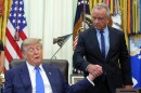 President Donald Trump, left, shakes the hand of Health and Human Services Secretary Robert F. Kennedy Jr. during a meeting to sign an executive order about vaccines Monday in the Oval Office of the White House.