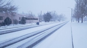 Snow accumulates on Gibson Blvd. in Albuquerque on Wednesday, Feb. 2, 2022