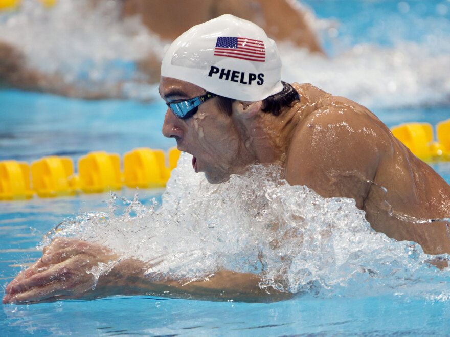 Michael Phelps swims in the men's 200-meter individual medley heat at the 2012 Summer Olympics in London.