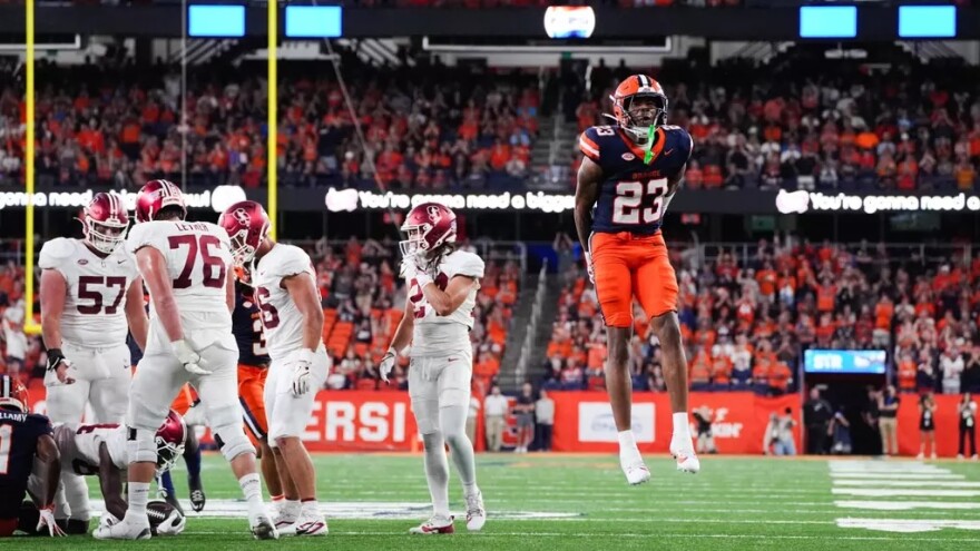 Devin Grant (23, blue) celebrating in Syracuse’s loss to Stanford