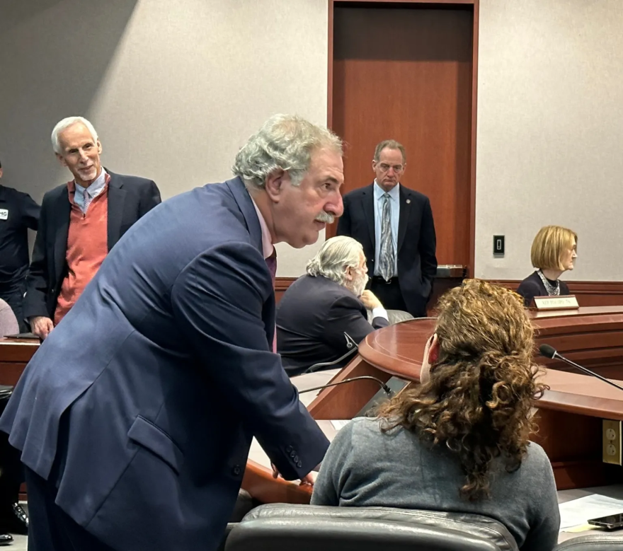 The energy co-chair, Rep. Jonathan Steinberg ,consults with Katie Dykes, the commissioner of energy and environmental protection before a hearing on energy prices and regulation. At left is the Senate co-chair, Norm Needleman.