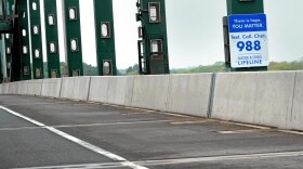 A sign on the Piscataqua River Bridge connecting Portsmouth, NH, to Kittery, Maine, reminds people that help is available for anyone experiencing a mental health crisis.
