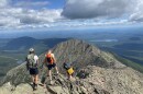 Hikers navigating the Knife Edge on Mt. Katahdin. Forty percent of summer visitors engaged in active outdoors activities, according to an annual report from the Maine Office of Tourism.