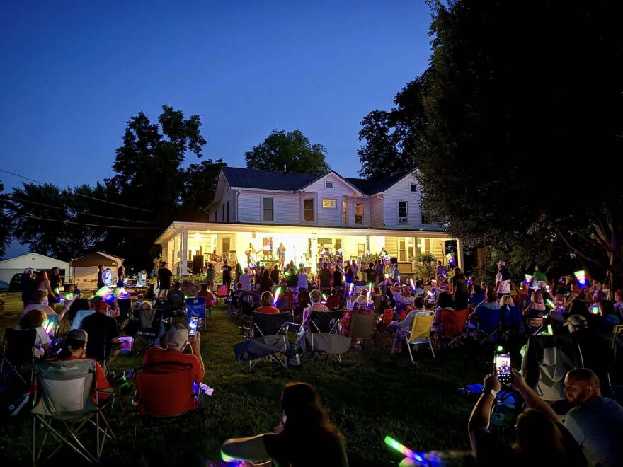 A crowd gathers at the front yard of the Taylor home for the Ca d'Zan (which means "house of John") House Concerts in Cambridge.