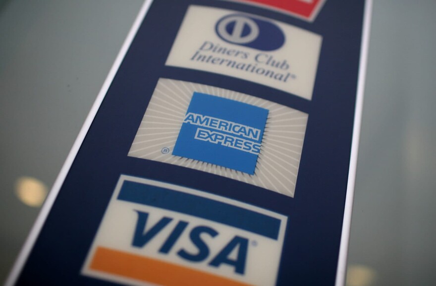 A sign showing the American Express logo is seen outside of a bank November 11, 2008 in Des Plaines, Illinois. (Justin Sullivan/Getty)