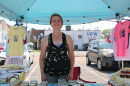 Cheryl Huffman stands at her booth at the Dowtown Poplar Bluff Farmer's Market. There's a table in front of her that displays her varied jellies.