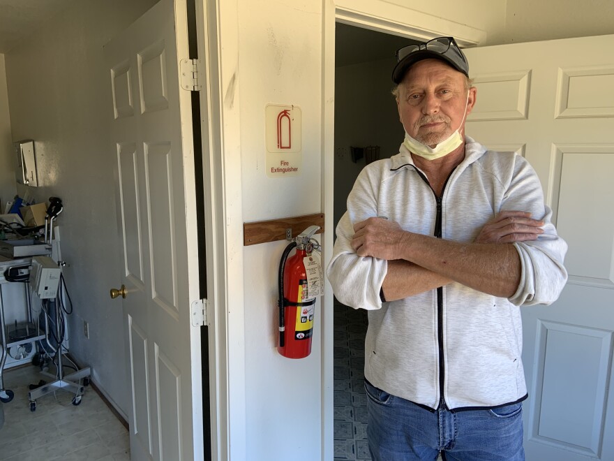 Randy Lindauer stands inside the building that's currently under renovation. Eventually, he says it'll serve as sleeping quarters for medical staff.