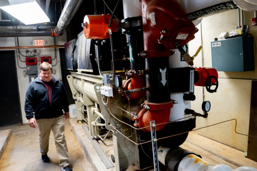 Russ Barton, AP Environmental Science teacher, walks past the school’s geothermal and chiller on Wednesday, May 3, 2023, during a tour of the plant at the school in Manchester. The Parkway School District was recognized by the U.S. Department of Energy for “demonstrating the energy and cost savings potential of renewable energy investments to schools across the country,” according to Alejandro Moreno, Acting Asst. U.S. Sec. for Energy Efficiency and Renewable Energy.