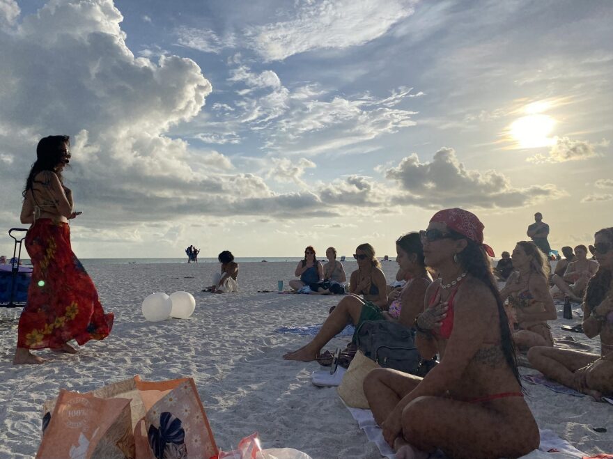 The Florida Witch leads the group in an energy release before beginning group affirmations.