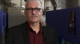A man looks at the camera
