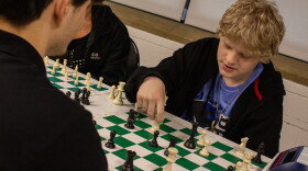 Gavin Hannah plays a practice chess game in preparation for a tournament during a Masters and Mentors class.