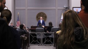 Eighty-Eight Coffee Co. owners Corey "Bo" Tong, left, and Natalia Umpierrez-Tong, right, at a packed meeting of the Board of Mayor and Aldermen in Manchester on Tuesday, Oct. 15, 2024. The coffee shop is on a disputed parcel of land the city plans on using to build the Cemetery Brook Drain Tunnel Project.