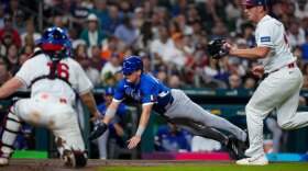 Italy shortstop Sam Antonacci (10) scores on a wild pitch by United States pitcher Brad Keller (40) in the sixth inning of a World Baseball Classic game, Tuesday, March 10, 2026, in Houston.