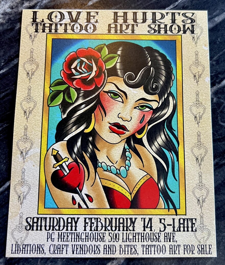 A woman with dark hair and green eyes is featured on a poster for a tattoo arts show. 
