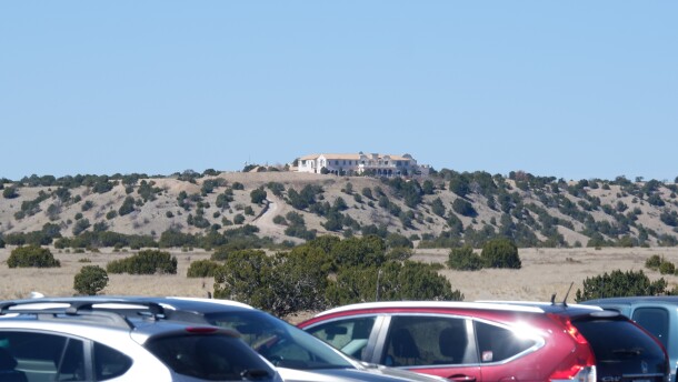 A view of Zorro Ranch from NM-41 as protesters' cars line the road