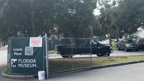 Construction fencing surrounds a work area outside the Florida Museum of Natural History in Gainesville, Florida, on Sept. 24, 2026. The museum is completing the final stages of its renovation before reopening its public exhibits.