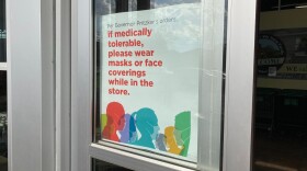 A sign asks customers to wear face coverings, which is required by Gov. J.B. Pritzker's most recent stay-at-home order. 