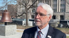 Timothy Killeen, president of the University of Illinois System, speaks to reporters outside of the Illinois State Capitol in Springfield.