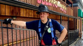 Kansas City firefighter John Dice standing in front of Buzzard Beach after a fire caused extensive damage to the bar.