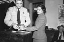 Rosa Parks, is fingerprinted by police Lt. D.H. Lackey in Montgomery, Ala., Feb. 22, 1956. She was among some 100 people charged with violating segregation laws. Parks refused to move to the back of a bus two months earlier on Dec 1, 1955. (Gene Herrick/AP)